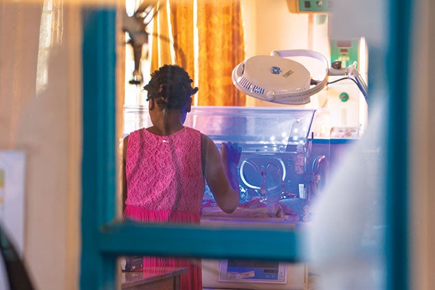 A Malawian mother checks on her baby at Zomba District Hospital’s neonatal ward. Photo by Brandon Martin
