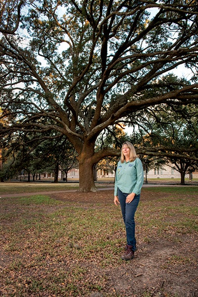 Rice Arborist Dawn Ellinger photographed near an oak tree on campus