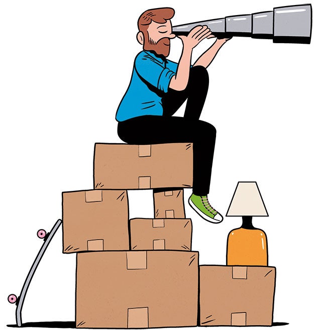 Man sitting on top of boxes