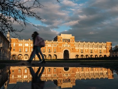 Photo: Lovett Hall mirrored in puddles of rain on the morning of Feb. 1, 2023