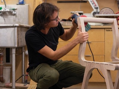A student building a chair