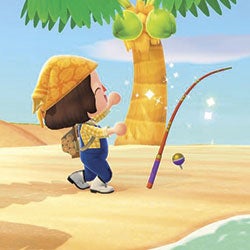 Deena on beach using fishing pole