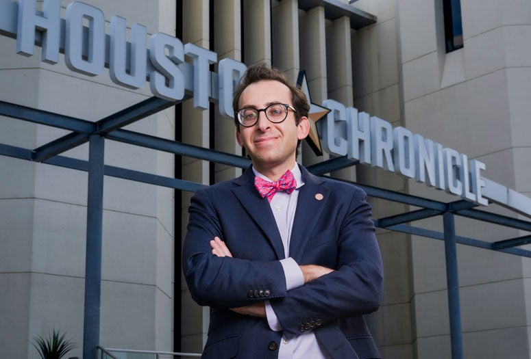 Photo of Evan Mintz in front of the Houston Chronicle building