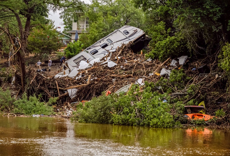 Photo of upturned RV on the banks of the Guadalupe river after flooding