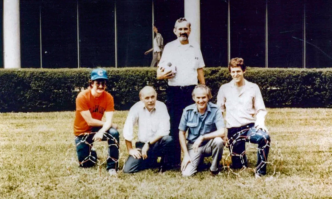 Photo of scientists posing outside the Space Science and Technology Building