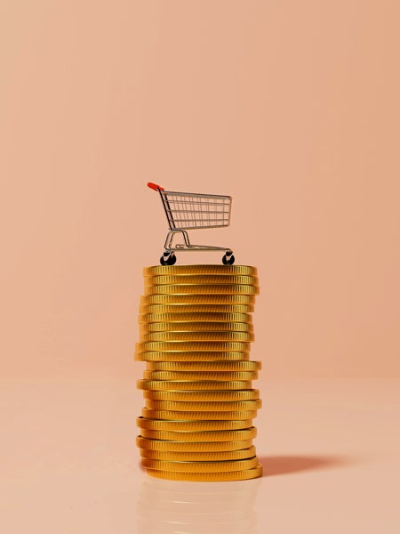 Grocery cart on stack of gold coins