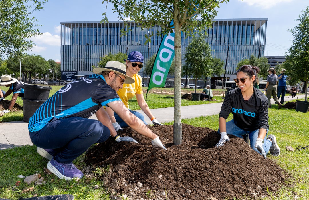 Photo of volunteers planting trees in front of the Ion building