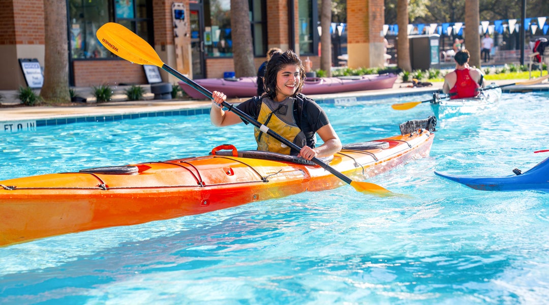 Photo of ROPE team leader in Rec pool practicing kayaking techniques