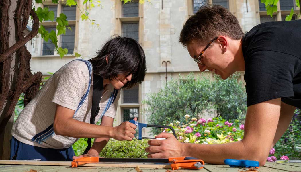 Photo of students in Paris working on an engineering prototype