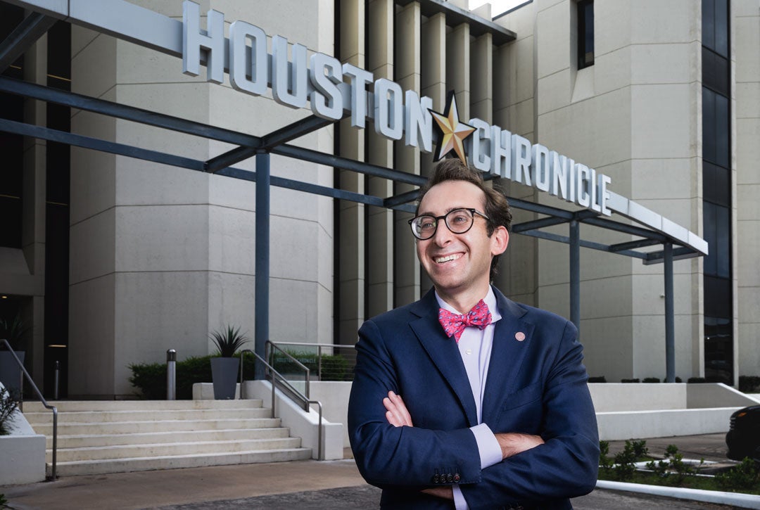 Photo of Evan Mintz in front of the Houston Chronicle building