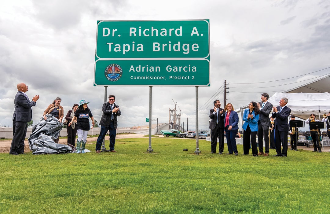 Photo of the sign next to the Tapia bridge during its dedication