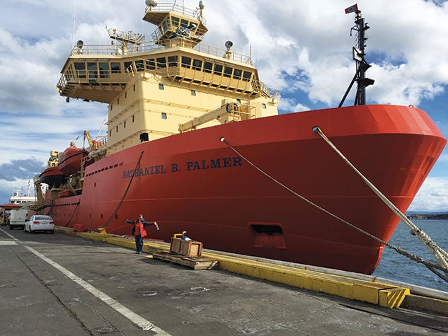 Linda Welzenbach poses next to the Palmer in Punta Arenas, Chile, before heading out on the Thwaites Glacier Offshore Research expedition.