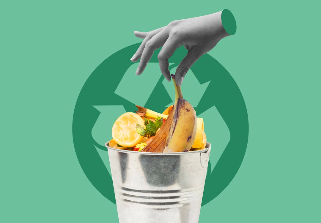 Photo illustration of hand dropping a banana peel into a composting bucket with the recycling logo in the back