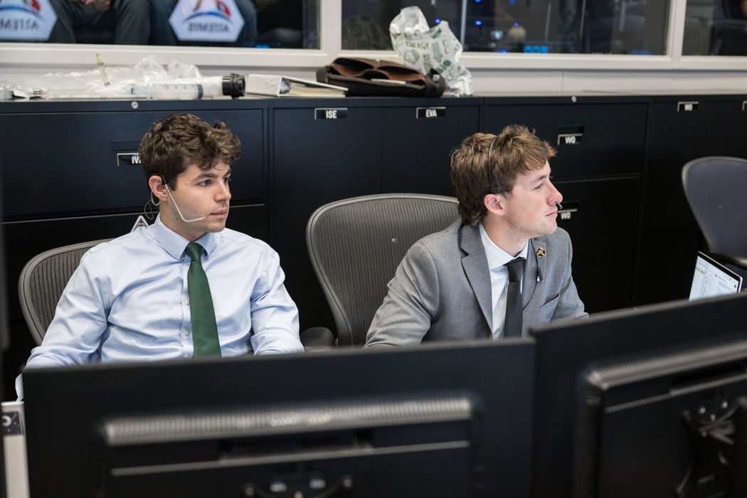 Photo of Will Coben and Wyeth McKinley in mission control