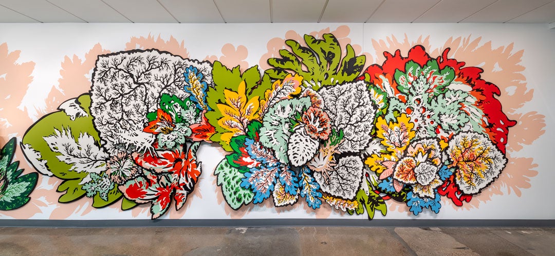 Natasha Bowdoin’s expansive, nature-inspired mural blooms across the biology building