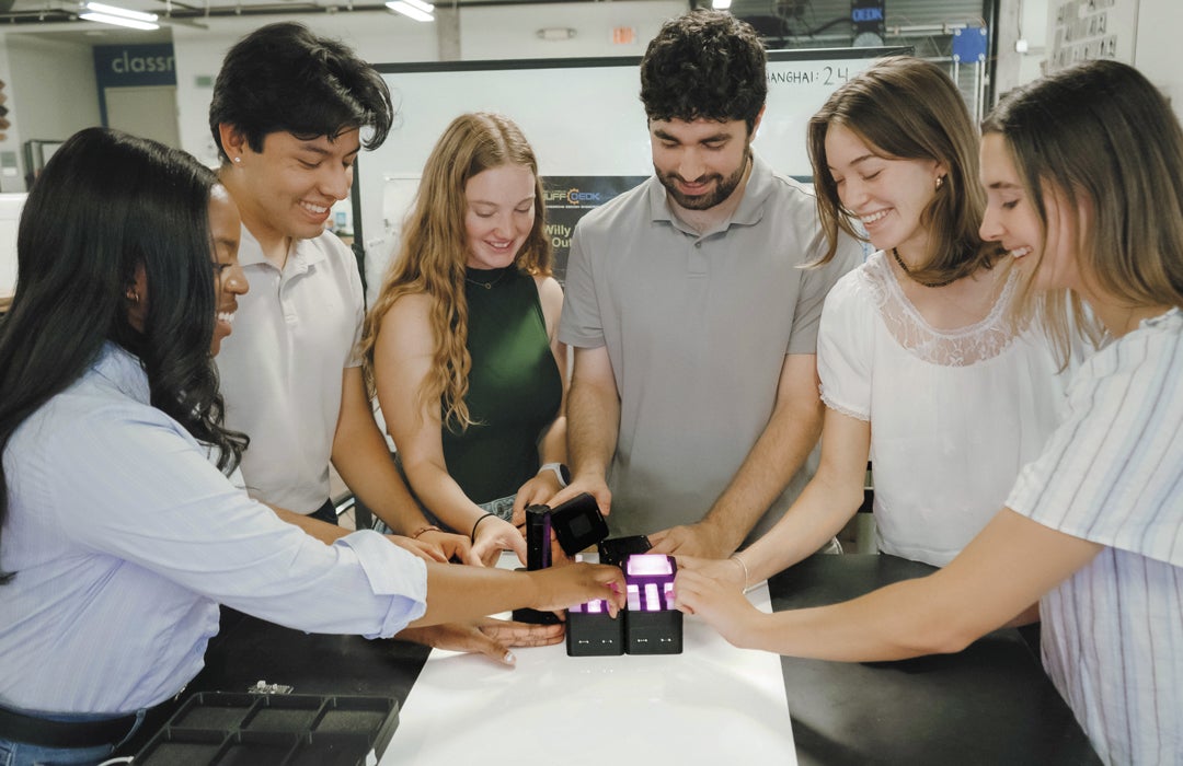 Photo of Rice students demonstrating how the interactive TacTile works