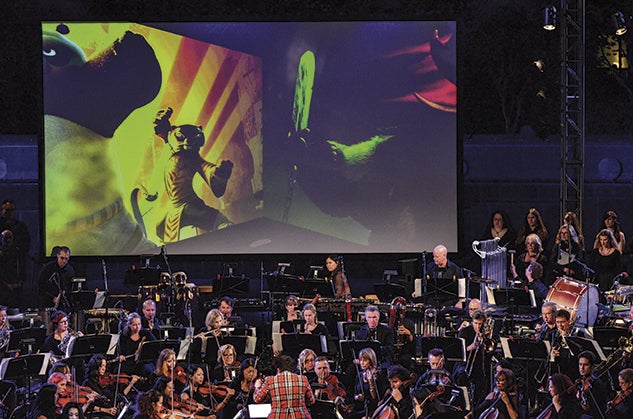 Franco conducts a performance of “Kung Fu Panda” with a full orchestra. Photo courtesy of Germaine Franco