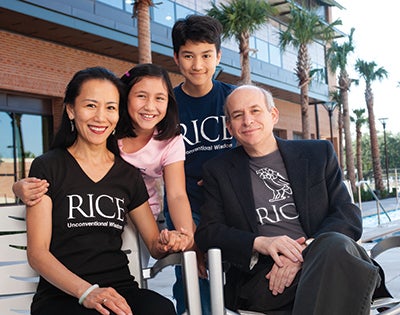 Leebron poses for a family holiday card at the Barbara and David Gibbs Recreation and Wellness Center with wife Ping Sun, daughter Mei Leebron and son Daniel Leebron, 2009. 