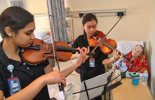 Rice MusicMDs play for a patient at Methodist Hospital.