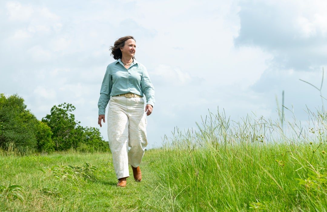 Photo of Elisa Donovan walking the grounds