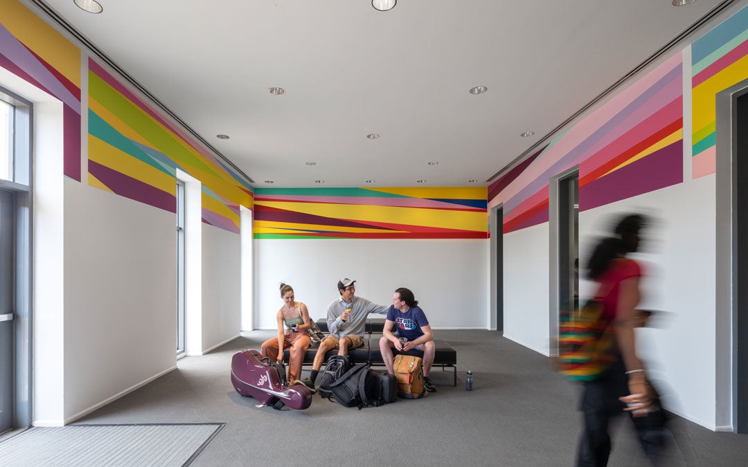 A vibrant wall painting by Odili Donald Odita at the Shepherd School of Music’s central corridor 
