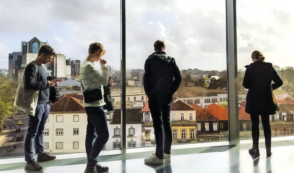 Photo of students looking out over the skyline in Portugal