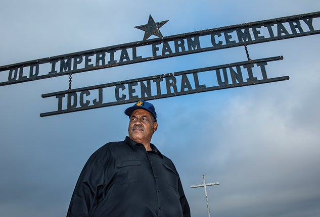 Reginald Moore at the gravesite at the Imperial State Prison Farm in Sugar Land