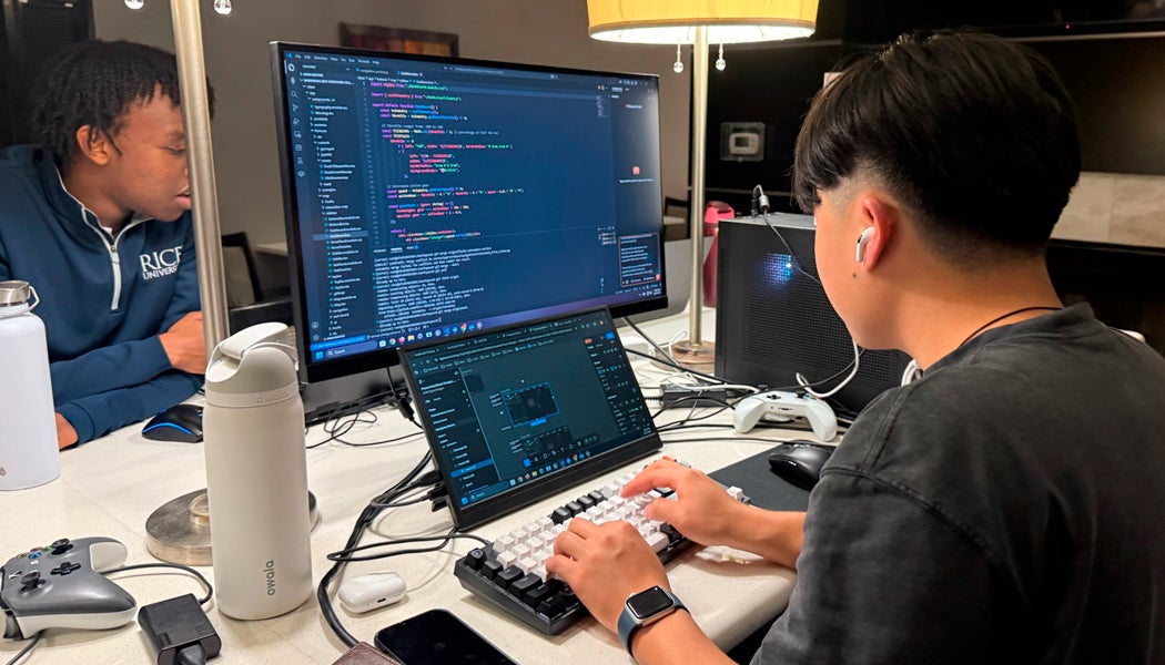 Photo of Rice students working together on their laptops