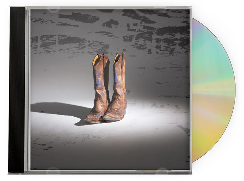 Album cover shows a pair of cowboy boots.