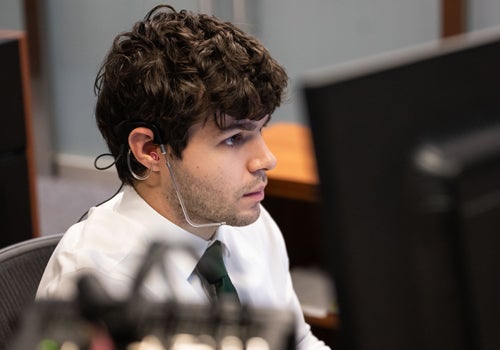 Action photo of Will Coben working in the control room