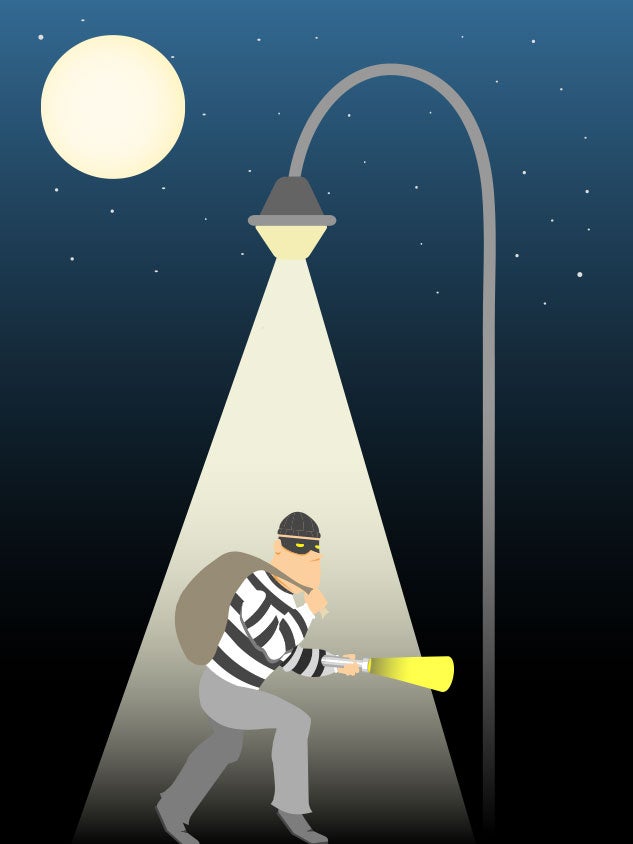 Illustration of a burglar under a streetlight