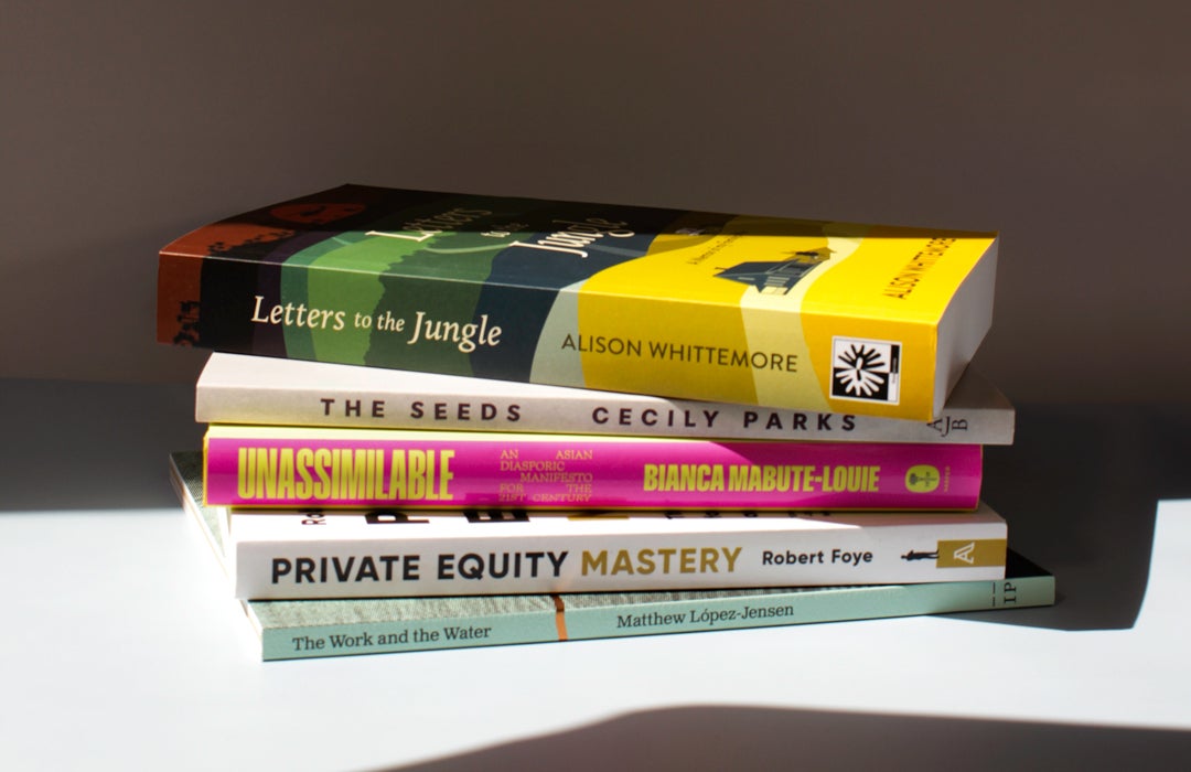 Photo of a stack of alumni books