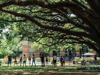 Rice students playing volleyball on campus