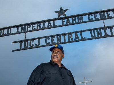 Reginald Moore at the gravesite at the Imperial State Prison Farm in Sugar Land. Photo by Tommy LaVergne
