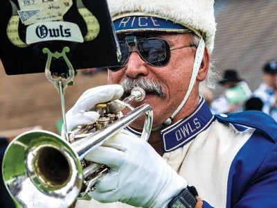 Grungy Gladu plays trumpet at Homecoming at his 50th anniversary at Rice