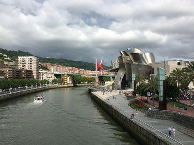 The Nervión River cuts the city of Bilbao, the largest city in the Basque Country, passing around the Guggenheim Museum Bilbao and under the Princes of Spain Bridge.