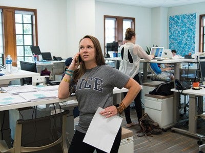 Lillie Besozzi ’16, senior associate director at the Doerr Institute, coordinates volunteers through R-HAT’s phone bank. Photo by Jeff Fitlow