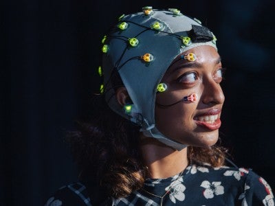 Photo of pianist wearing a mobile brain-body imaging cap
