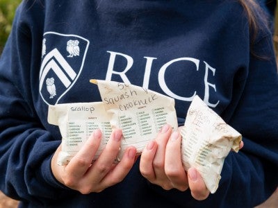 Rice student holding seed packets