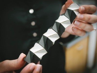 Photo of a paper model of a structure made from origami engineering.