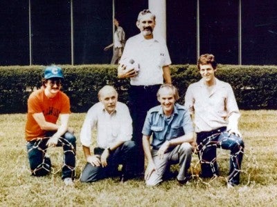 Photo of scientists posing outside the Space Science and Technology Building