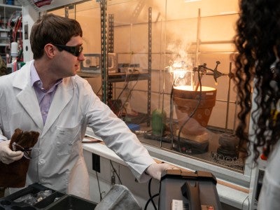 Photo of Lucas Eddy in the lab