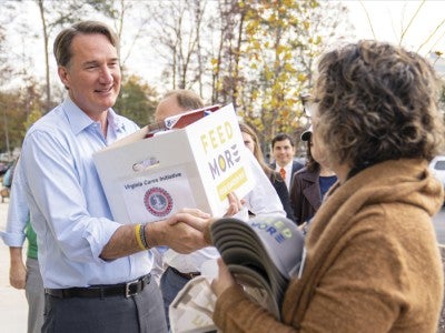 Photo of Glenn Youngkin volunteering with a nonprofit