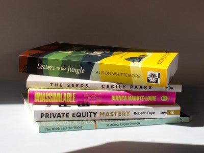 Photo of a stack of alum books