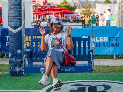 Photo of Rice volunteer sitting on swing