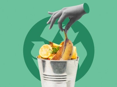 Photo illustration of hand dropping a banana peel into a composting bucket with the recycling logo in the back