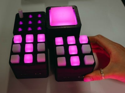 Photo of interactive modular tiles that are lit up