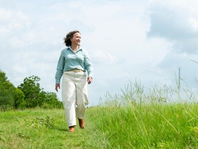 Photo of Elisa Donovan walking the grounds