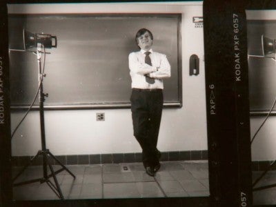 Archive photo of Richard Tapia leaning against a chalkboard