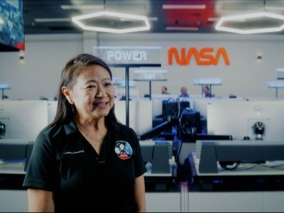 Photo of Quyen Jones in the Artemis mission control room at Johnson Space Center